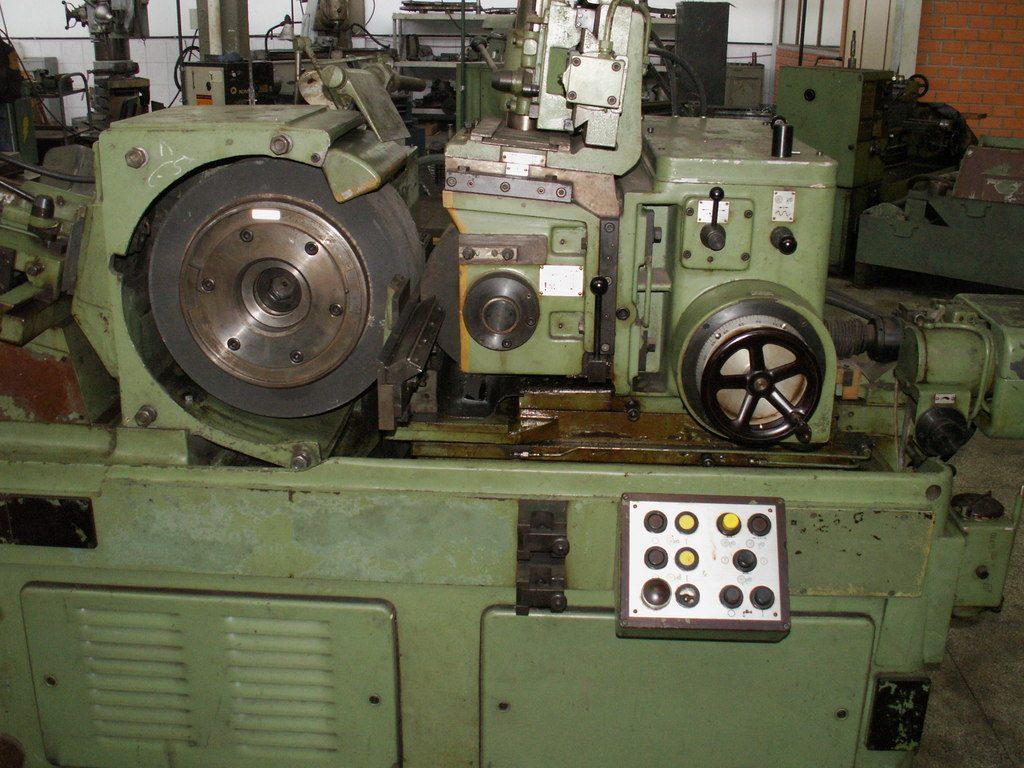 An industrial grinding machine with a large grinding wheel