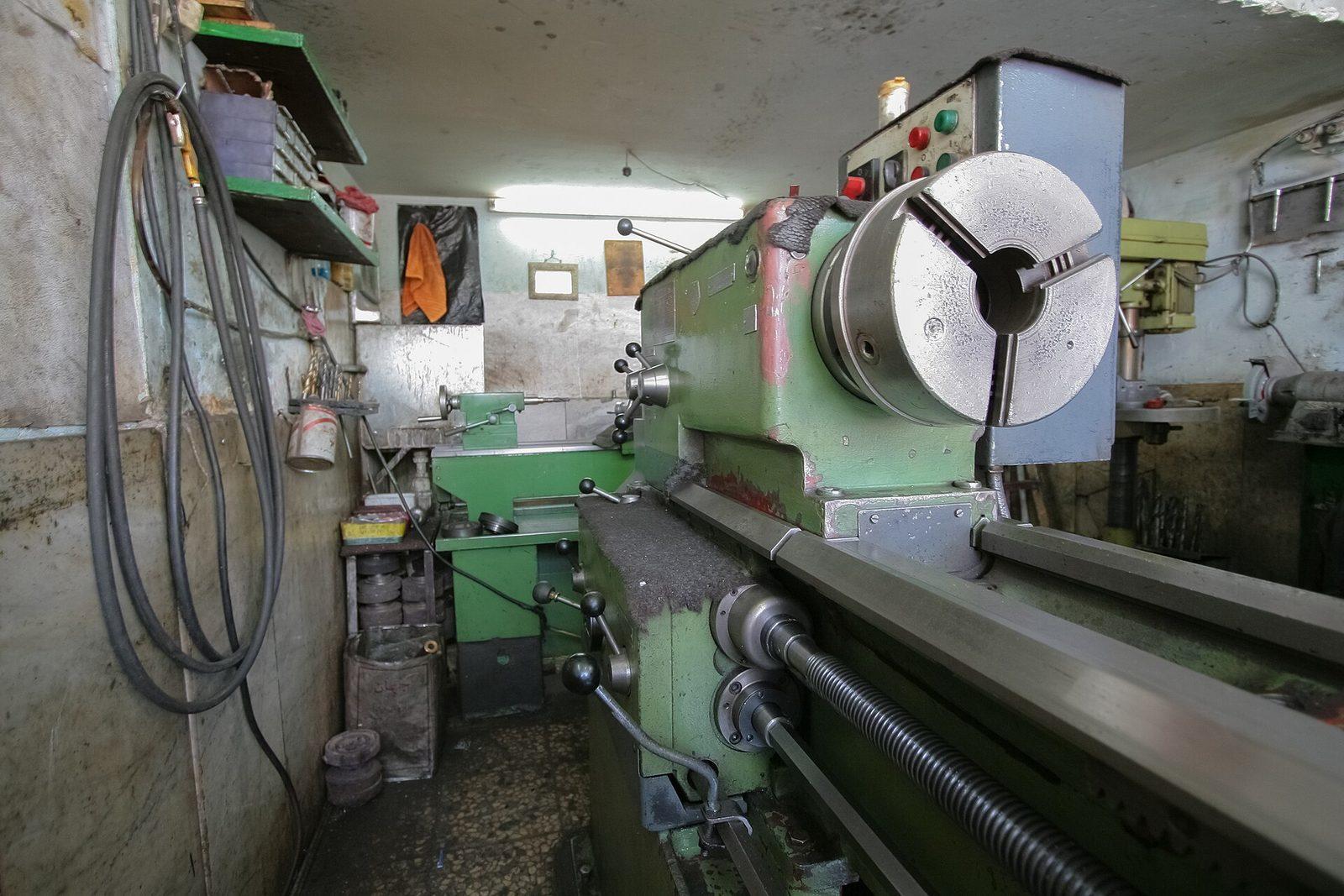 A workpiece held in a lathe chuck being turned