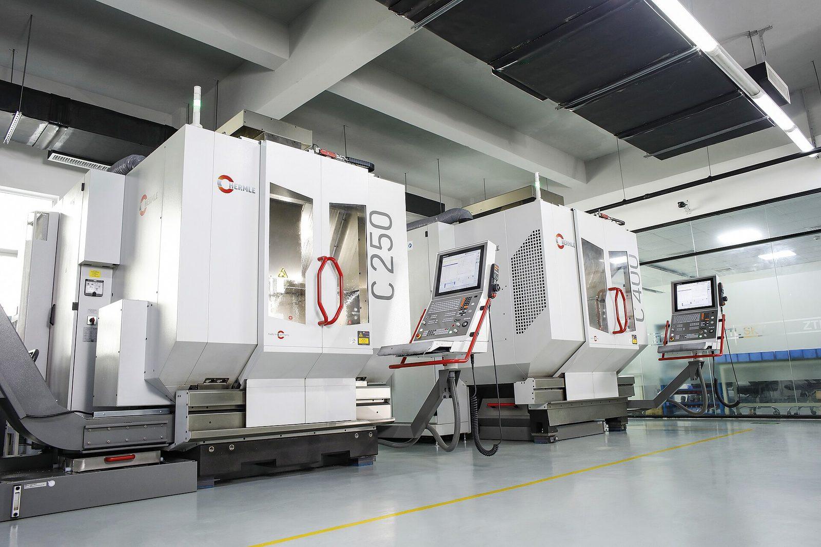 Two five-axis CNC machining centres in a machine shop
