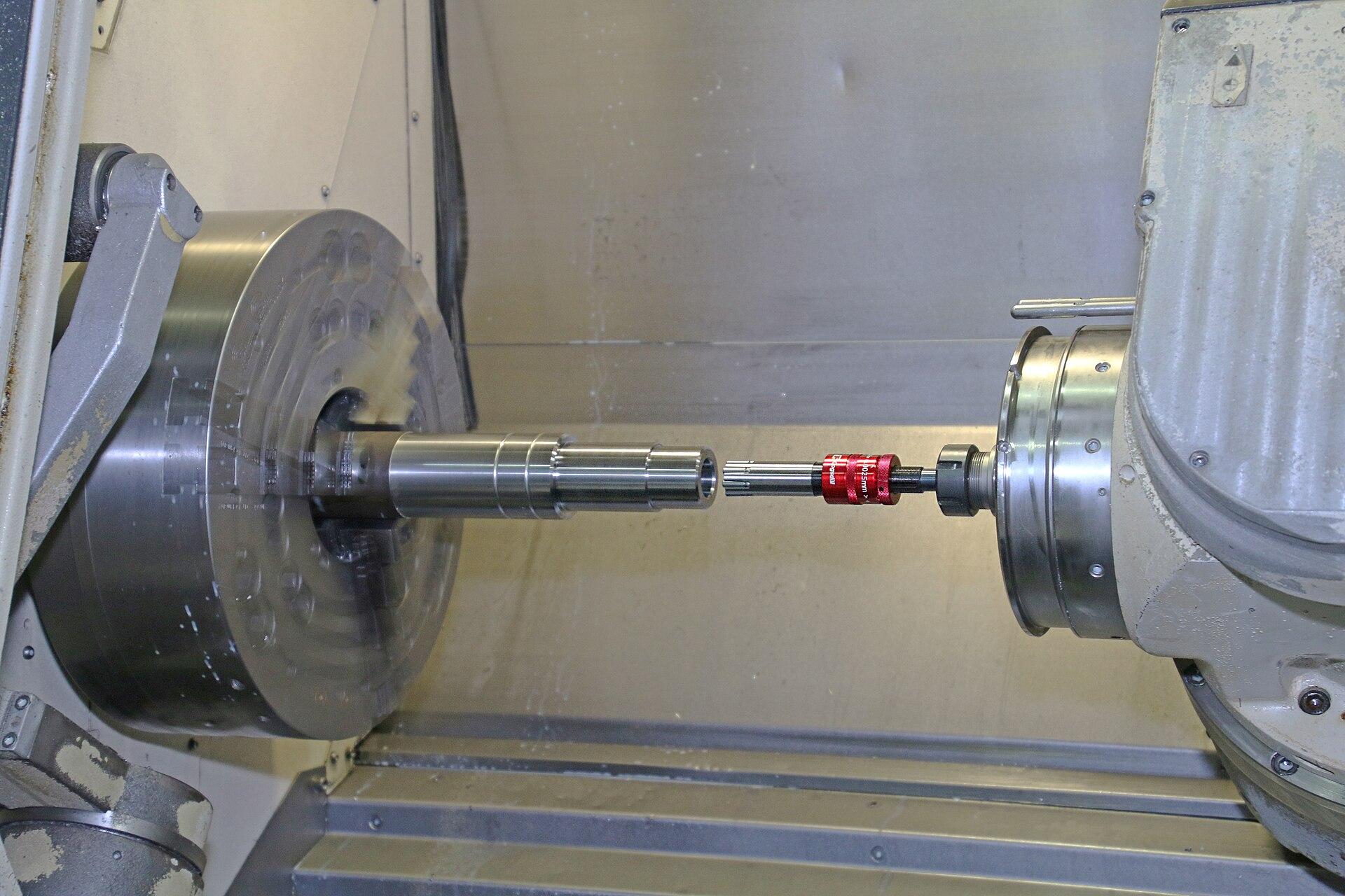 Part machined between centers on a CNC lathe
