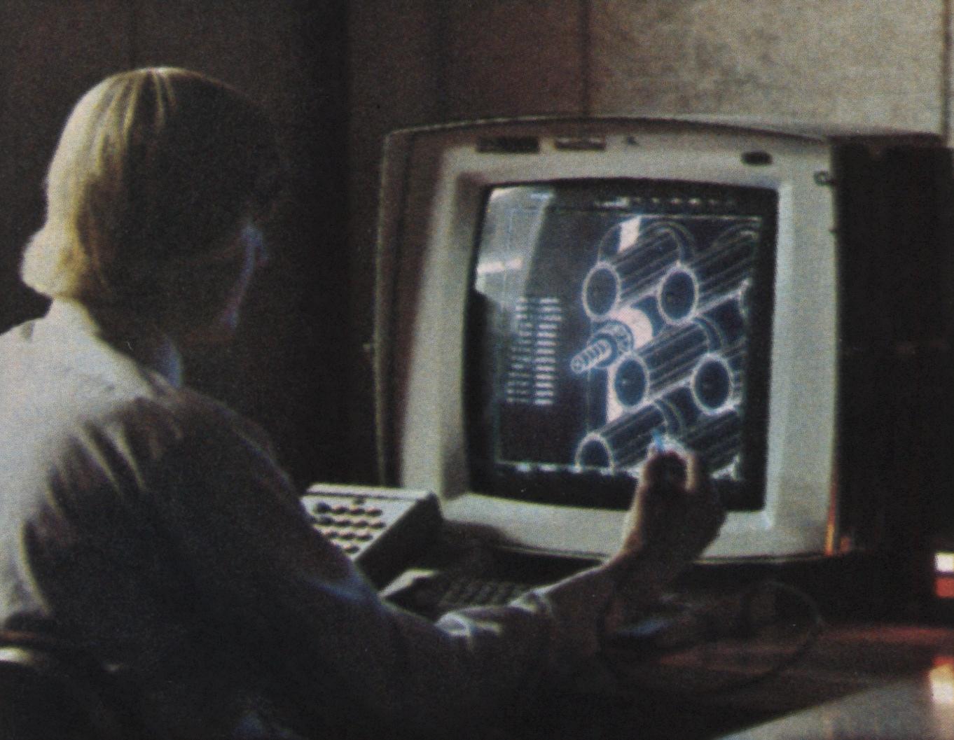 Engineer working at a CAD workstation with a light pen